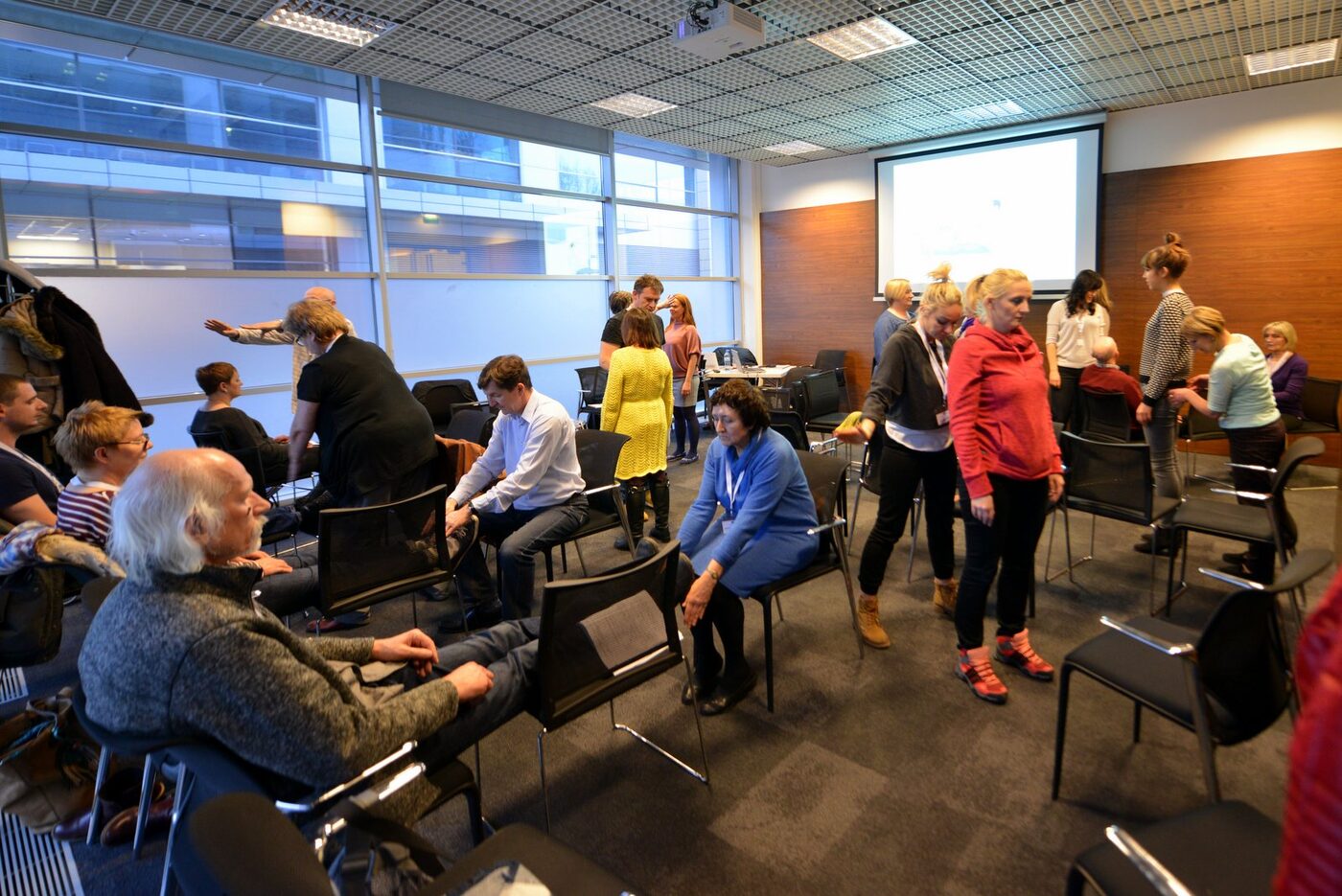Participants practising bioenergy techniques during a Domančić method workshop